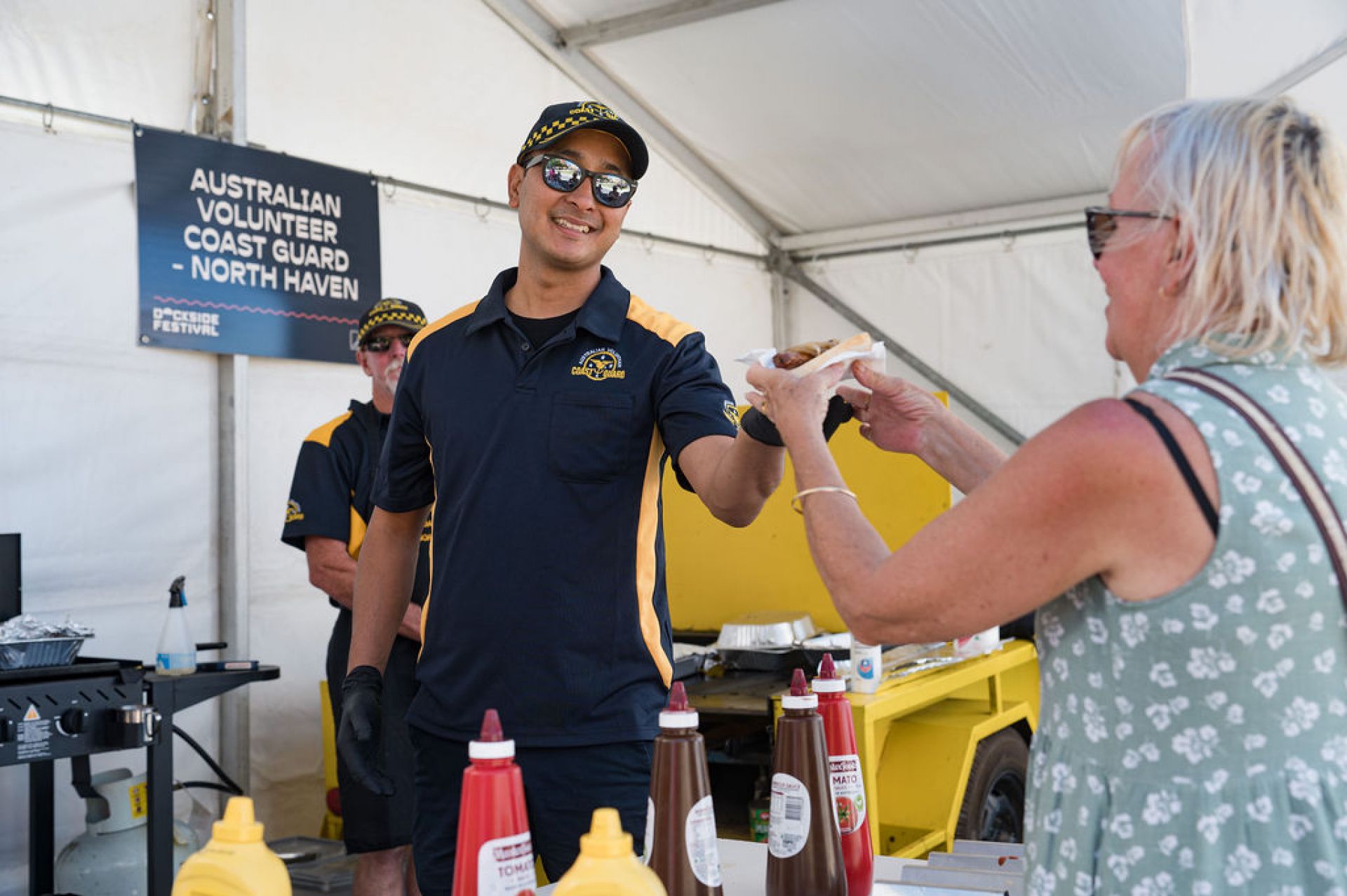 Community BBQ volunteer serving food